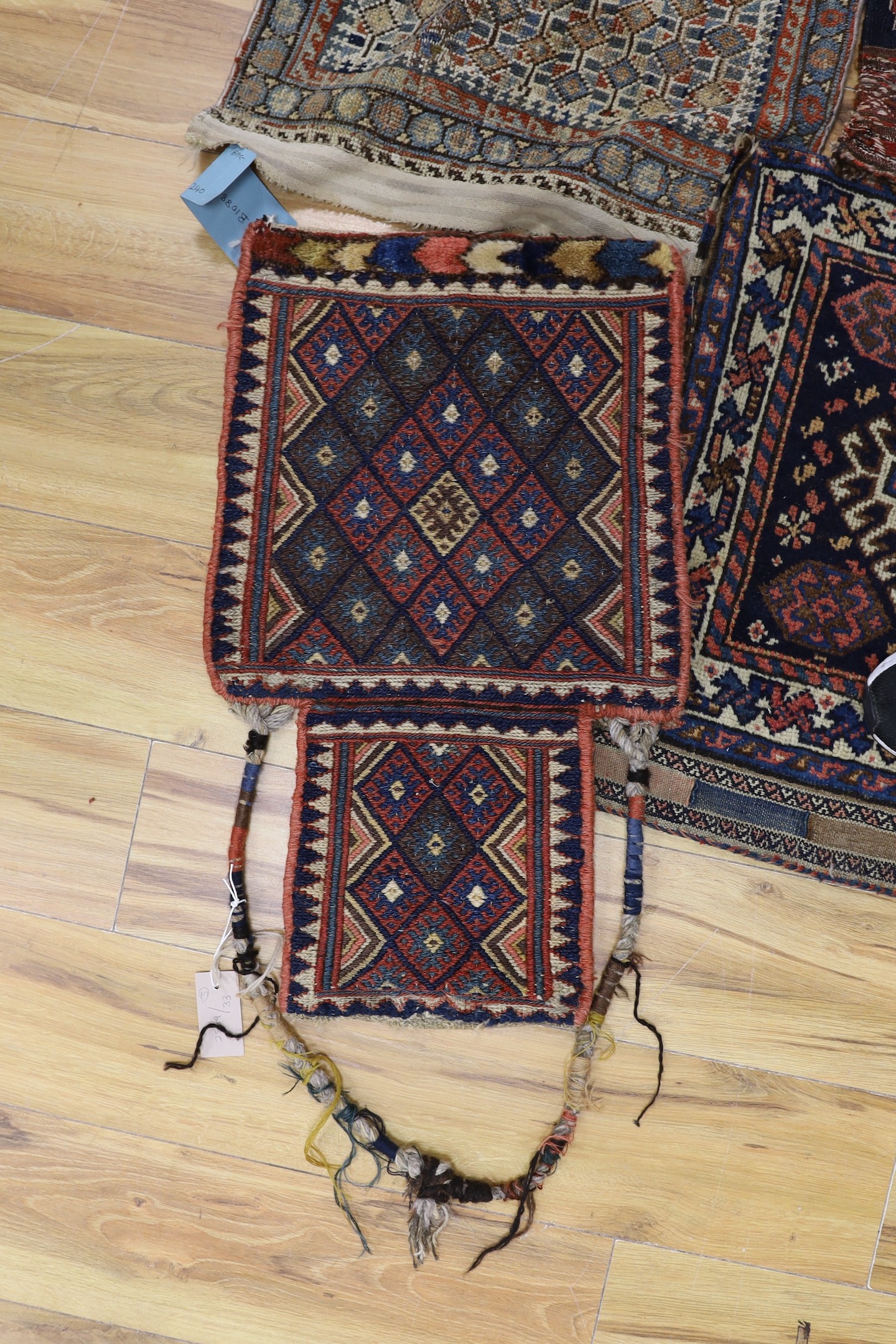 Two carpet saddlebags: Kasquai and a Shamdavan salt bag, a Kilim panel, a Soumac and a Tekke fragment
